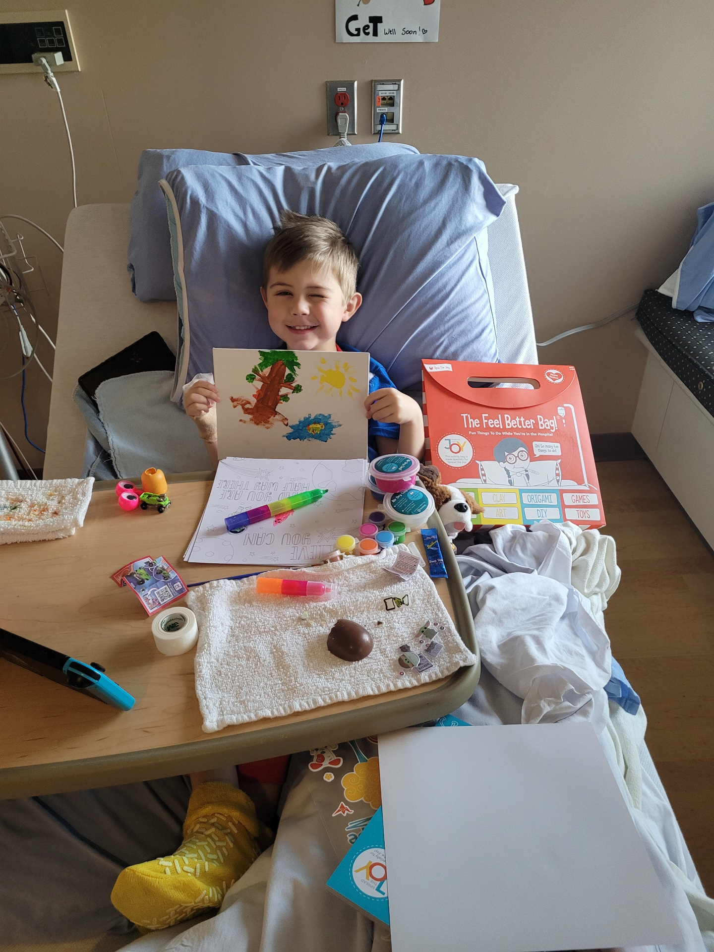 A child in the hospital with a Joy Box